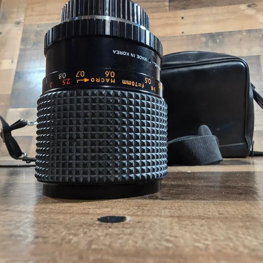 Minolta X370 with a JC Penny f=80 to 200mm zoom lens and prospect f=28-70mm lens
